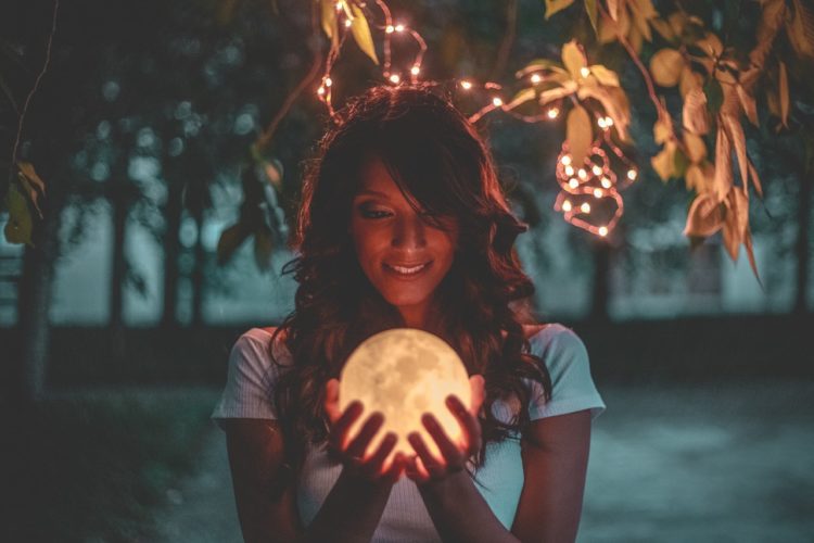 woman holding crystal ball