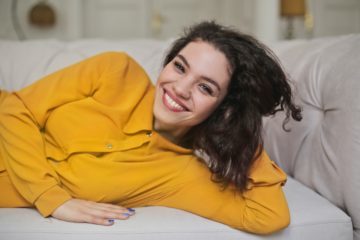 woman resting head on hand