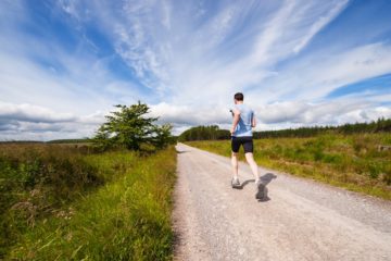 man running on nature trail