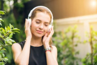 woman listening on headphones